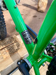 The Surly Karate Monkey is a chromoly steel trail bike that offers loads of versatility. Capable of riding singletrack and just as happy loaded down on a massive bikepacking expedition. It has clearance for 29 x 2.5” or 27.5 x 3” tires, is kitted out with loads of different mounts for racks and cages, and is offered in a build with a 140mm travel fork, their rigid steel fork, or as a frameset. 