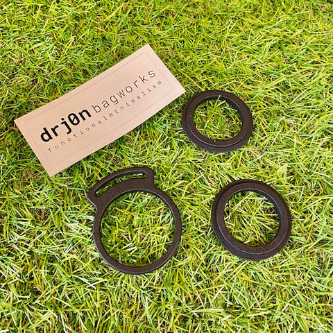 Drj0n Bagworks - drj0n bagworks DeWidget. In Stock. Bath Outdoors stocks a wide range of Drj0n Bagworks bikepacking kit perfect for mountain bikes, gravel bikes, adventure bikes, touring bikes, road bikes, commuter bikes & bikepacking bikes. Slip the DeWidget in between the spacers on your headset at the appropriate height to secure your top tube bag and you're away... bathoutdoors.co.uk is an official stockist of Drj0n Bagworks bikepacking accessories.